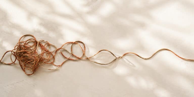 Tangled rope gradually straightening, symbolising how to get rid of anxiety and regain calm