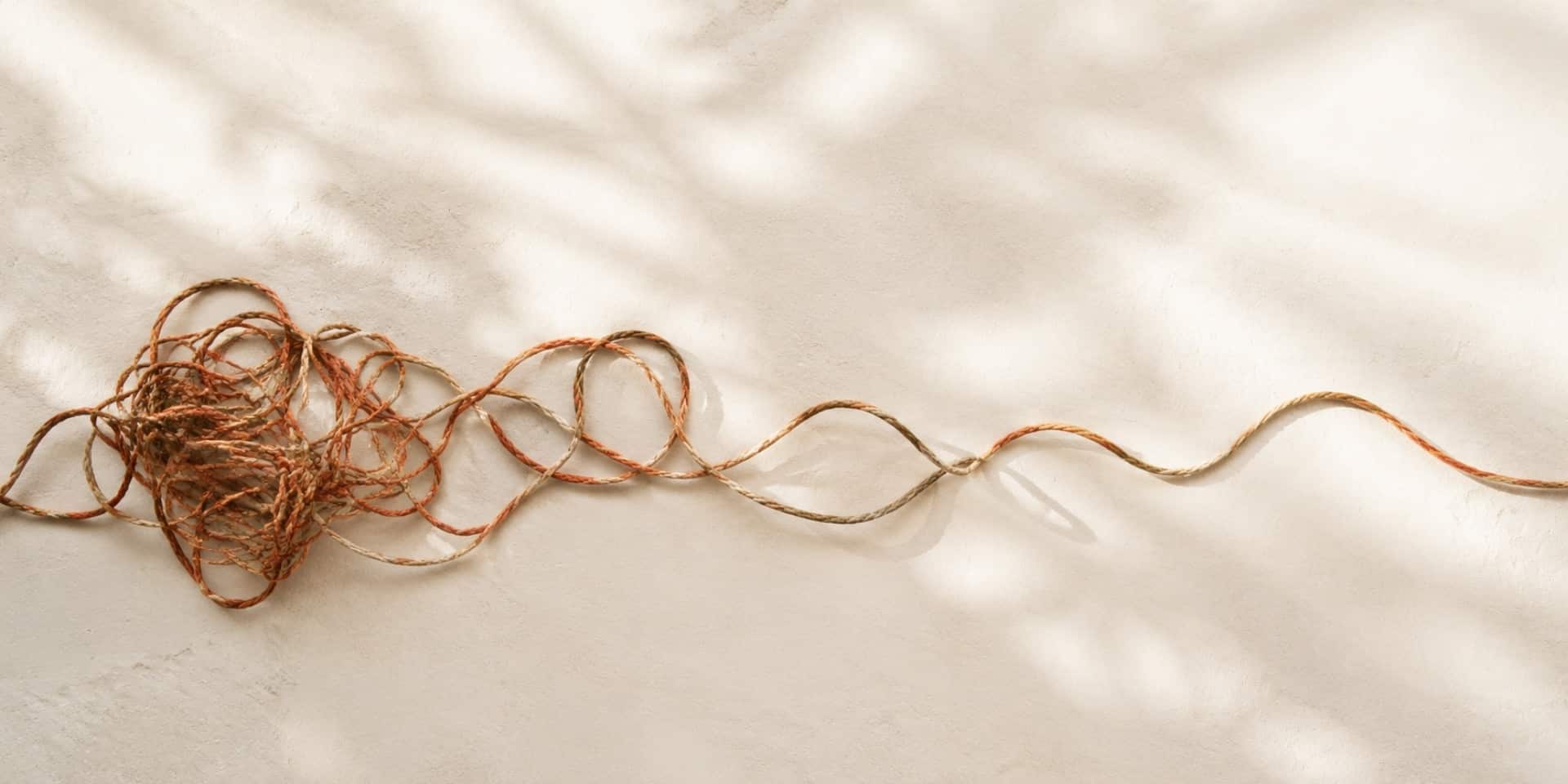 Tangled rope gradually straightening, symbolising how to get rid of anxiety and regain calm