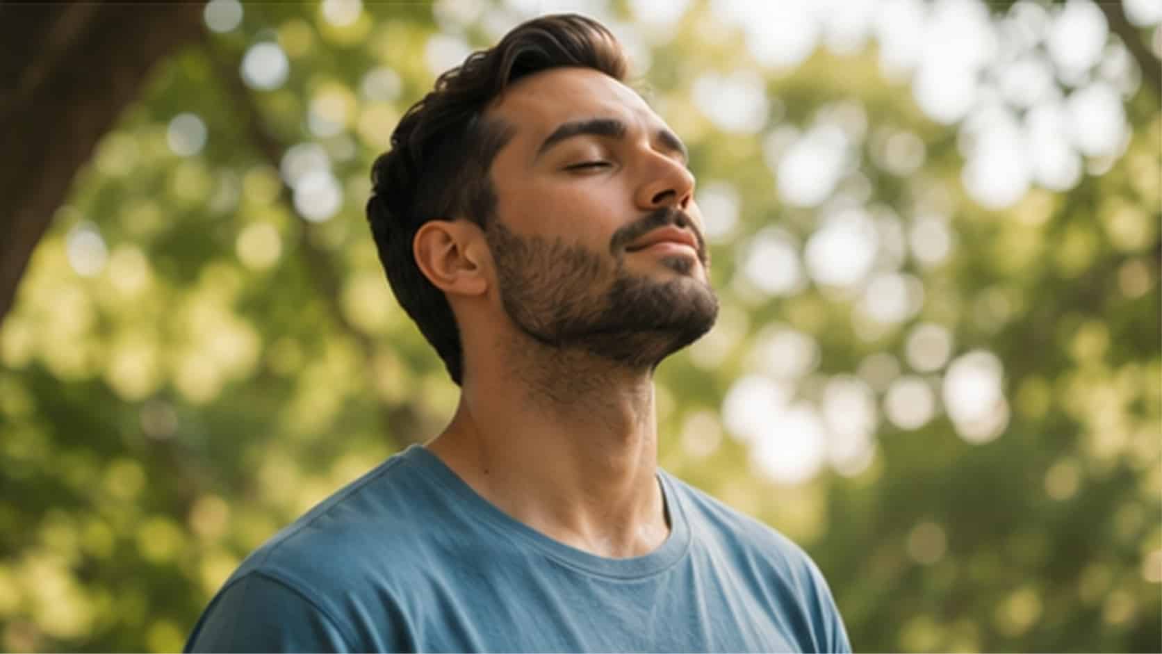 Man breathing calmly outdoors as part of managing emotional responses